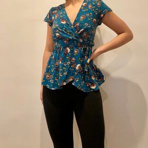 XHILARATION WRAP AROUND BLUE FLORAL BLOUSE